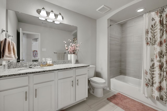 bathroom featuring toilet, shower / bath combo, and vanity