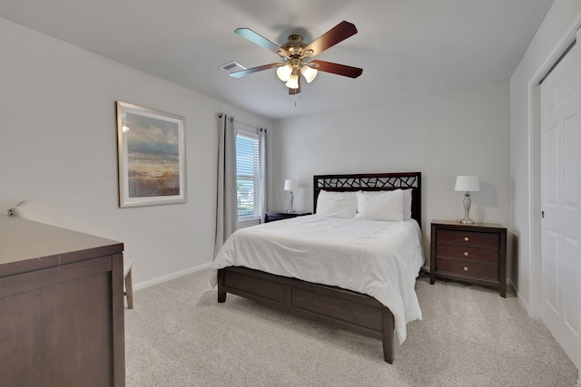 bedroom featuring carpet, baseboards, a ceiling fan, and a closet