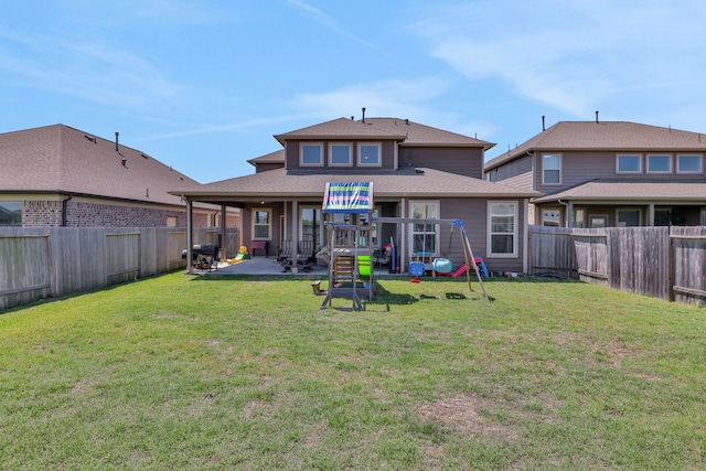 rear view of property featuring a patio and a shingled roof