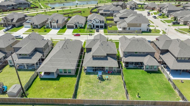 aerial perspective of suburban area with a large body of water