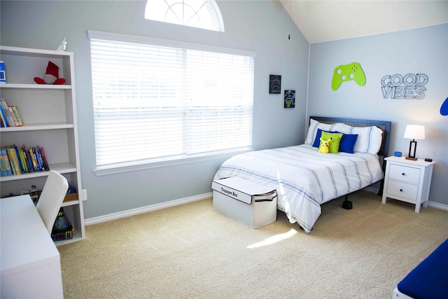 carpeted bedroom with baseboards, multiple windows, and lofted ceiling
