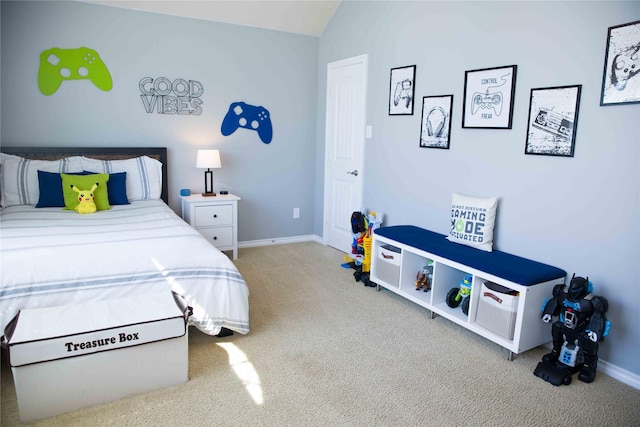 bedroom featuring baseboards, carpet flooring, and lofted ceiling