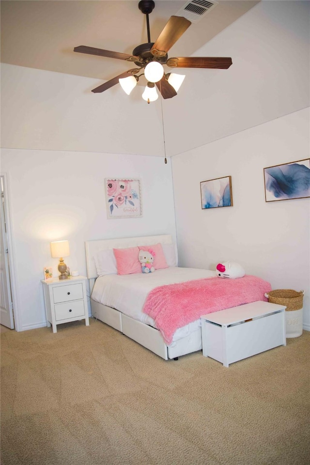 bedroom with carpet floors, visible vents, baseboards, and lofted ceiling