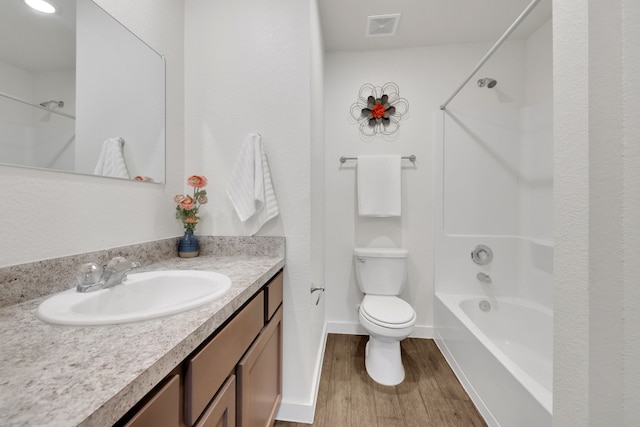 12603 Telge Rd Unit 30C-D, Cypress, TX 77429 - bathroom with wood finished floors, vanity, toilet, bathtub / shower combination, and baseboards