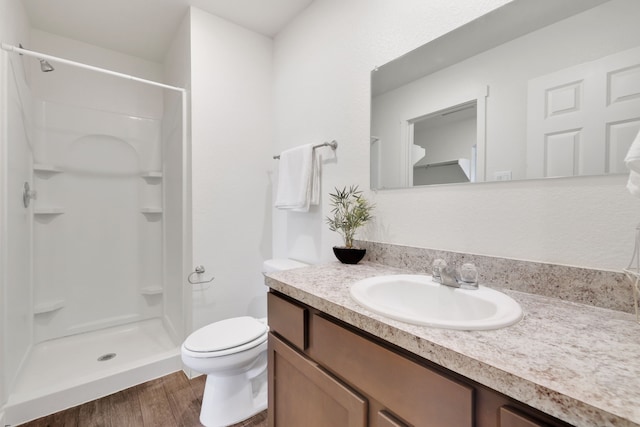 12603 Telge Rd Unit 30C-D, Cypress, TX 77429 - full bath featuring a stall shower, vanity, toilet, and wood finished floors