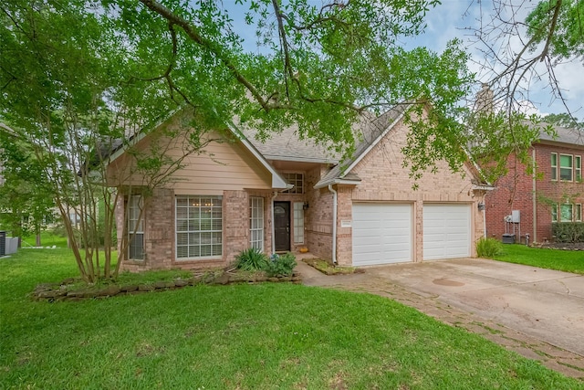 18914 Hikers Trail Dr, Humble, TX 77346 - view of front facade with driveway, a garage, brick siding, and a front lawn