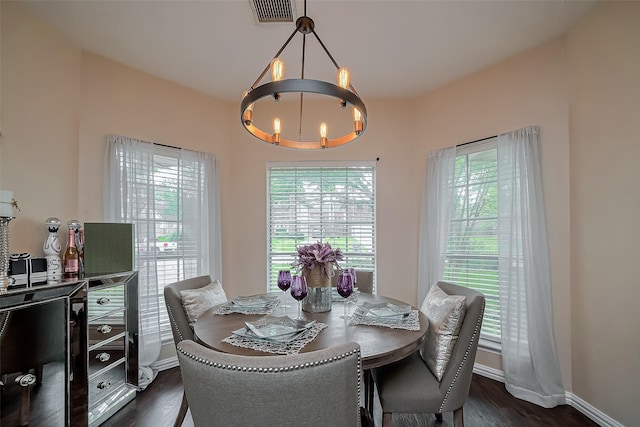 18914 Hikers Trail Dr, Humble, TX 77346 - dining room featuring a chandelier, dark wood finished floors, and baseboards