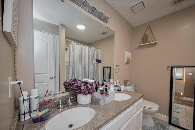 18914 Hikers Trail Dr, Humble, TX 77346 - bathroom with toilet, double vanity, a shower with curtain, and tile patterned flooring