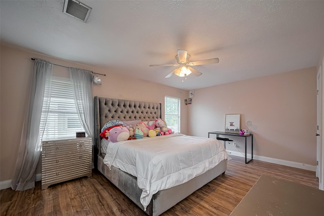 18914 Hikers Trail Dr, Humble, TX 77346 - bedroom with baseboards, wood finished floors, and ceiling fan