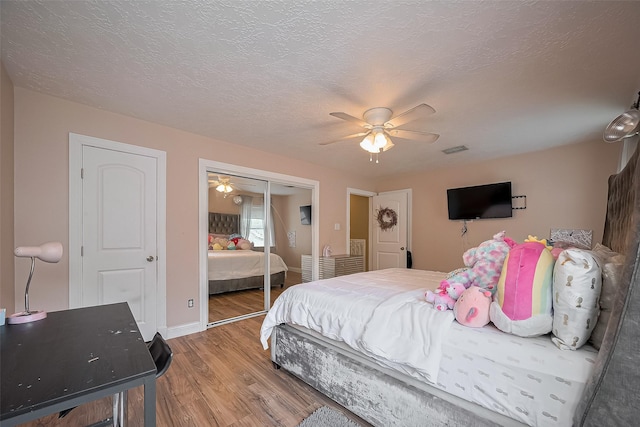 18914 Hikers Trail Dr, Humble, TX 77346 - bedroom featuring wood finished floors, a closet, ceiling fan, and baseboards