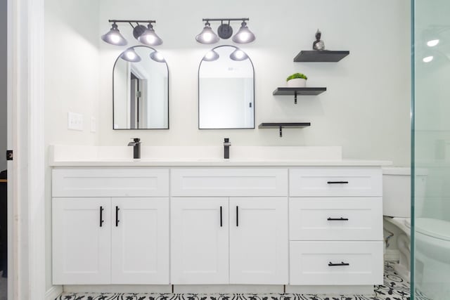 3718 Prudence Dr, Houston, TX 77045 - full bathroom with toilet, double vanity, and a sink