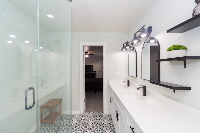3718 Prudence Dr, Houston, TX 77045 - full bath with a stall shower, a sink, tile patterned floors, double vanity, and baseboards