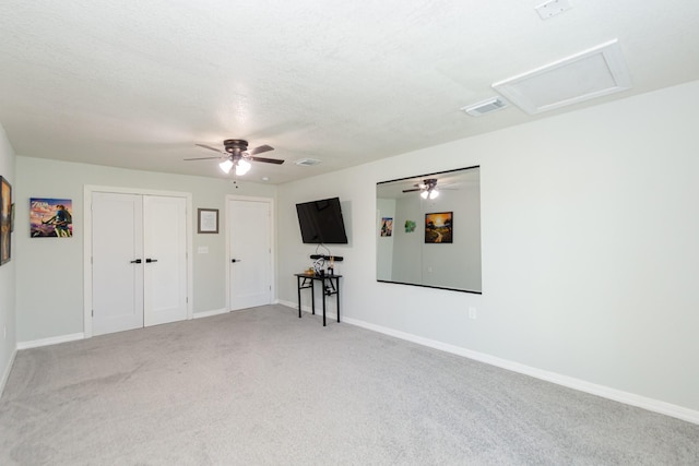 3718 Prudence Dr, Houston, TX 77045 - unfurnished living room with baseboards, light carpet, attic access, a ceiling fan, and visible vents
