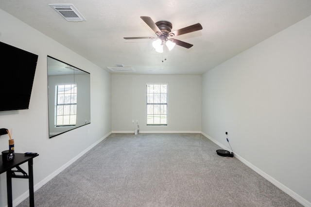 3718 Prudence Dr, Houston, TX 77045 - carpeted empty room featuring ceiling fan, baseboards, visible vents, and plenty of natural light