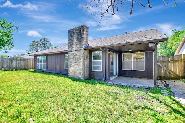 6902 Desert Rose Ln, Houston, TX 77086 - back of house featuring a patio area, a chimney, and a shingled roof