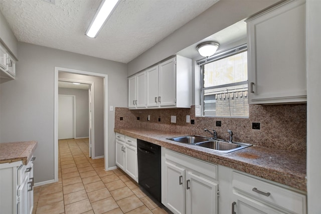 6902 Desert Rose Ln, Houston, TX 77086 - kitchen with a sink, black dishwasher, backsplash, light tile patterned floors, and white cabinets