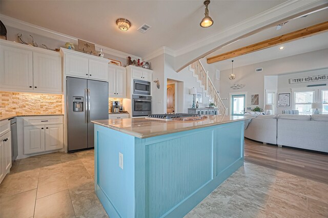 kitchen with stainless steel appliances, tasteful backsplash, white cabinets, and ornamental molding