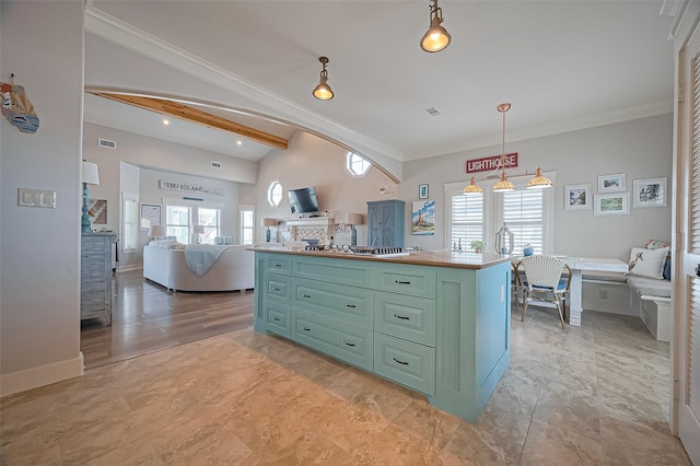 kitchen featuring ornamental molding, lofted ceiling, green cabinetry, and plenty of natural light
