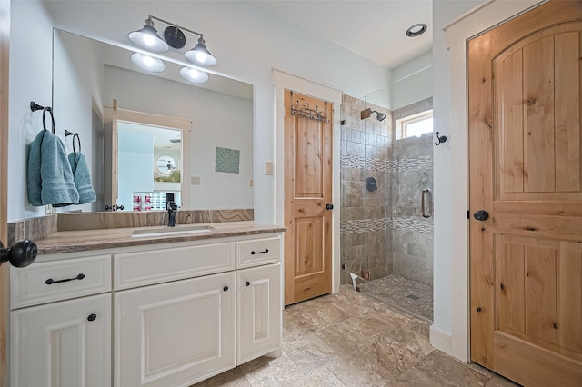 full bathroom featuring a shower stall and vanity