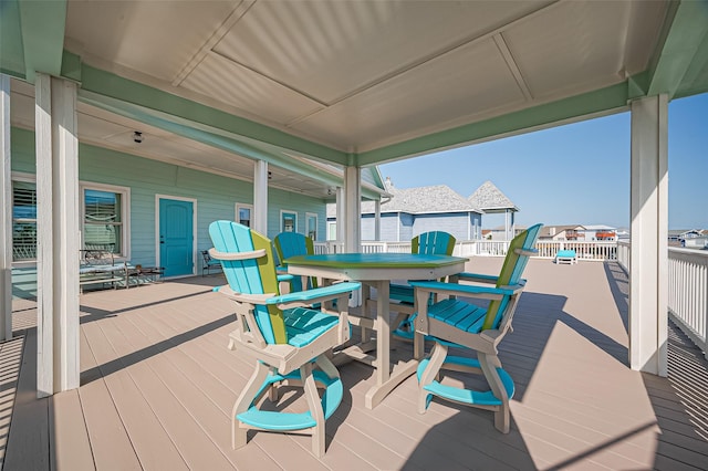 wooden deck featuring outdoor dining space