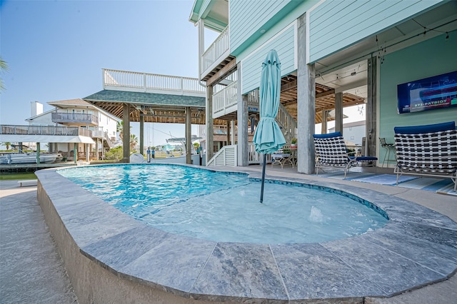 view of swimming pool with stairway