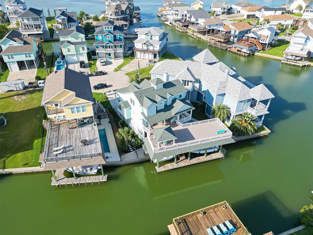 birds eye view of property featuring a water view and a residential view