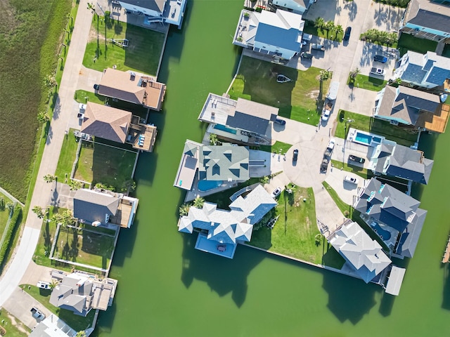 bird's eye view featuring a residential view and a water view
