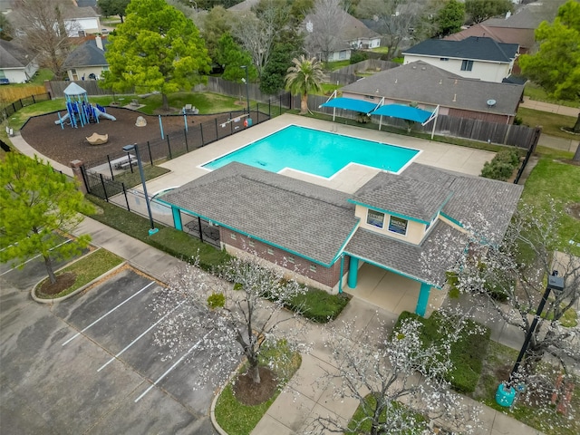 view of swimming pool with fence