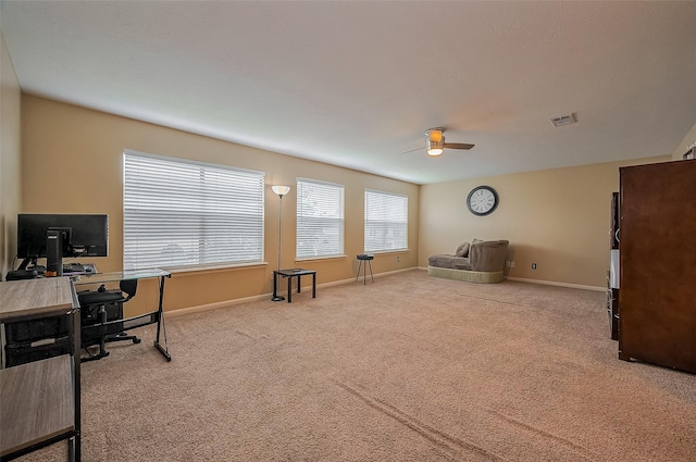 office area featuring carpet floors, a ceiling fan, baseboards, and visible vents