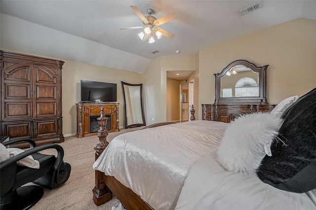 bedroom featuring carpet flooring, baseboards, visible vents, and lofted ceiling
