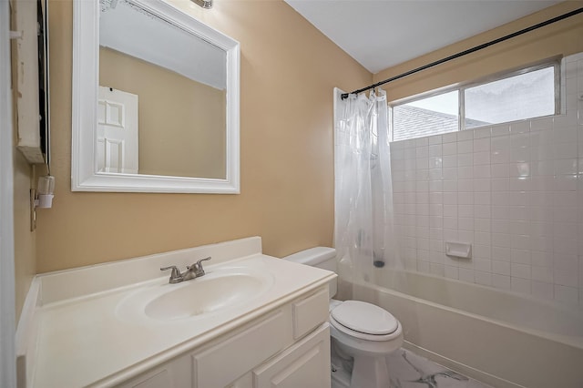 bathroom featuring toilet, shower / bath combo with shower curtain, marble finish floor, and vanity