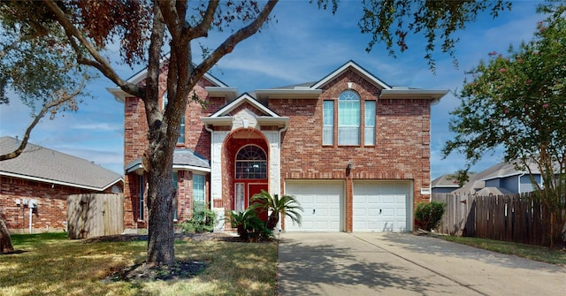 16410 Bluff Springs Dr, Houston, TX 77095 - traditional-style home with driveway, a garage, fence, and brick siding