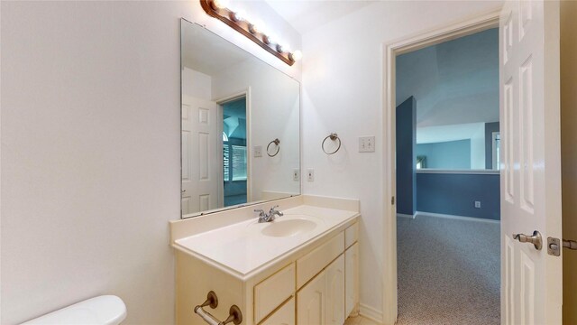 16410 Bluff Springs Dr, Houston, TX 77095 - half bath with toilet, vanity, and baseboards