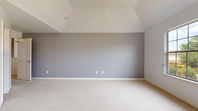 16410 Bluff Springs Dr, Houston, TX 77095 - spare room featuring light carpet, baseboards, and vaulted ceiling