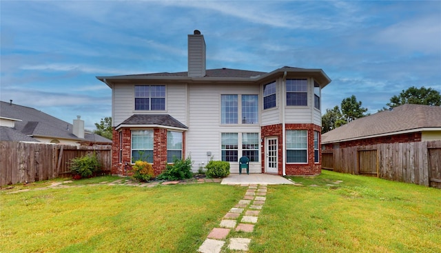 16410 Bluff Springs Dr, Houston, TX 77095 - rear view of property with a yard, brick siding, and a fenced backyard