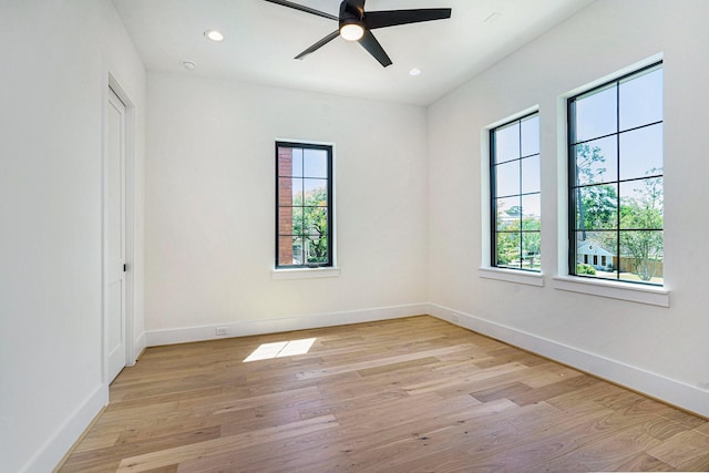 unfurnished room with recessed lighting, light wood-style floors, baseboards, and a ceiling fan