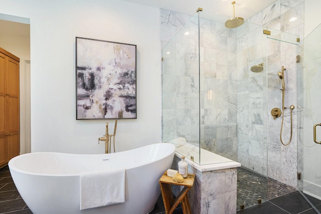 bathroom featuring a freestanding bath and a stall shower