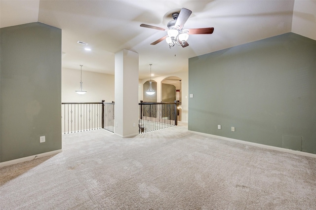 8719 Seguin Cove Ln, Richmond, TX 77407 - unfurnished room with arched walkways, a ceiling fan, visible vents, carpet flooring, and lofted ceiling