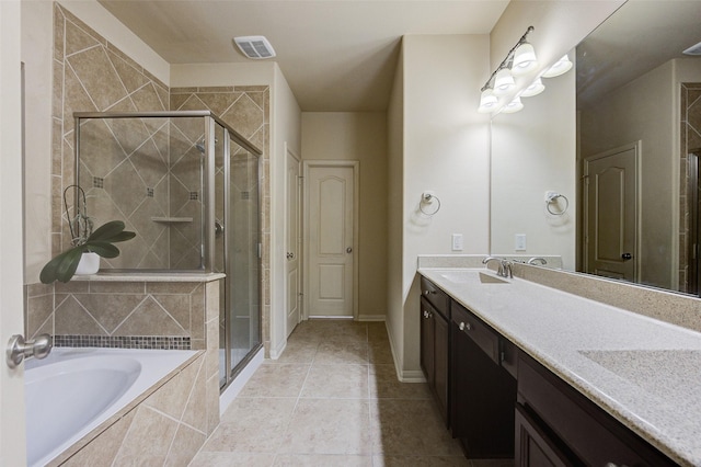 8719 Seguin Cove Ln, Richmond, TX 77407 - bathroom with visible vents, a bath, a sink, double vanity, and a stall shower