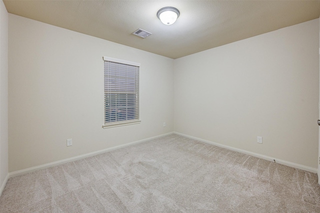 8719 Seguin Cove Ln, Richmond, TX 77407 - carpeted spare room with baseboards and visible vents