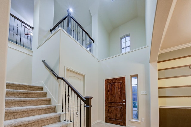 8719 Seguin Cove Ln, Richmond, TX 77407 - foyer featuring a high ceiling and stairway