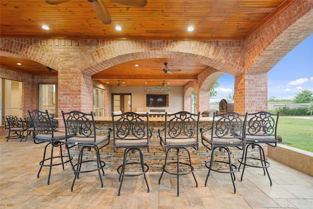 view of patio with ceiling fan and outdoor dry bar