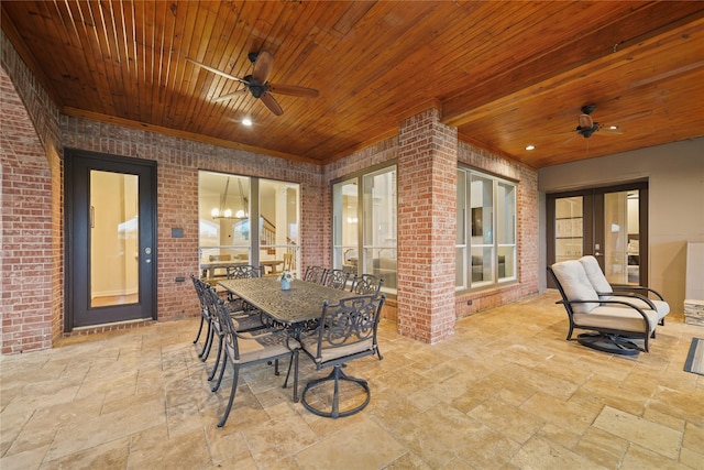 view of patio with french doors, outdoor dining area, and a ceiling fan
