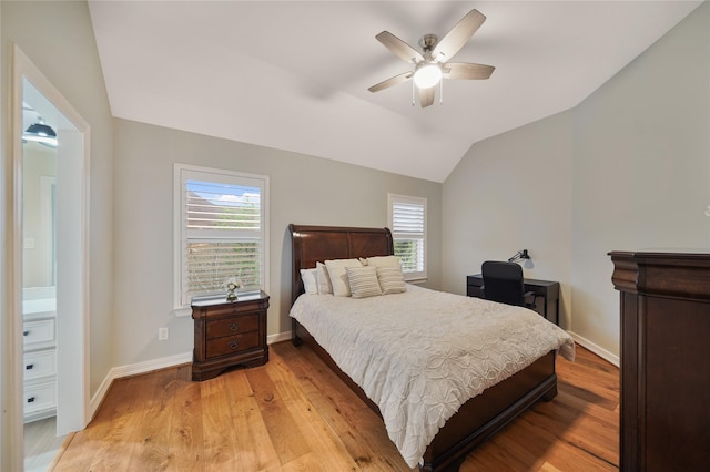 bedroom featuring light wood-type flooring, baseboards, a ceiling fan, and vaulted ceiling