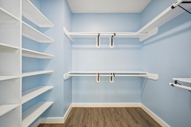 1322 Outrigger, Tiki Island, TX 77554 - walk in closet with wood finished floors