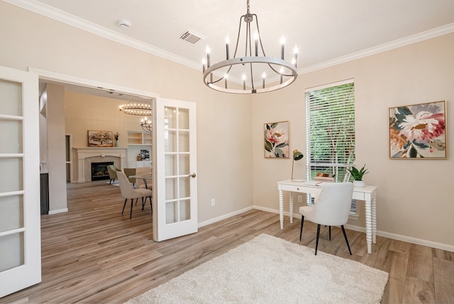 office featuring a notable chandelier, ornamental molding, and wood finished floors