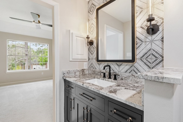 bathroom with a ceiling fan and vanity