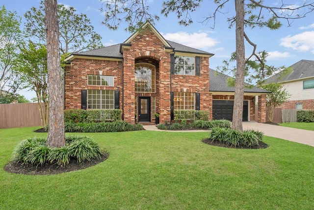 traditional home with brick siding, fence, and a garage