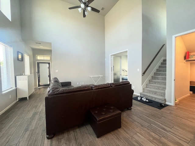 10427 Cecilia Star Ln, Richmond, TX 77406 - living room with ceiling fan, baseboards, wood finished floors, and stairs
