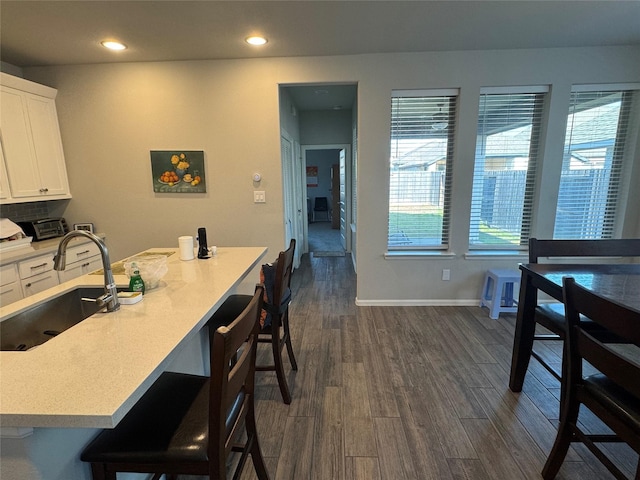 10427 Cecilia Star Ln, Richmond, TX 77406 - dining area featuring recessed lighting, dark wood-style flooring, and baseboards